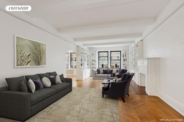 440 W End Ave Unit 5B, New York City, NY 10024 - living room with arched walkways, baseboards, beamed ceiling, a fireplace, and built in shelves