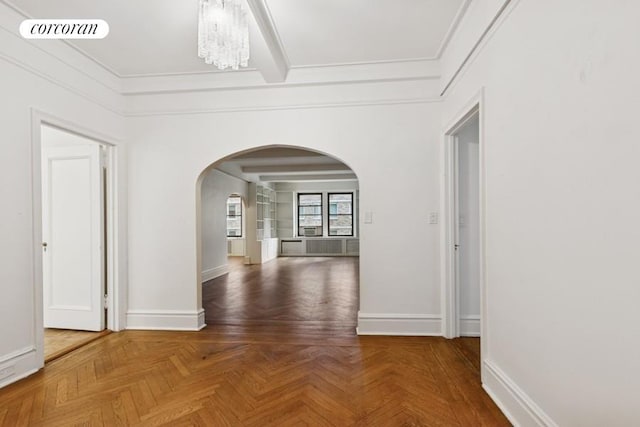 440 W End Ave Unit 5B, New York City, NY 10024 - hall with arched walkways, crown molding, baseboards, and a chandelier