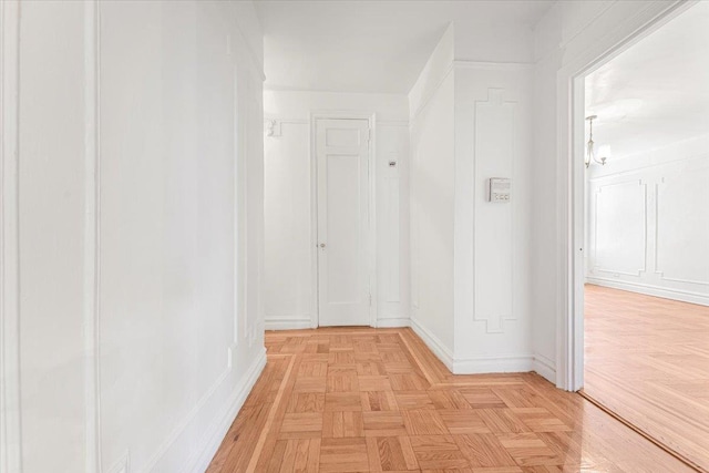 hall featuring baseboards