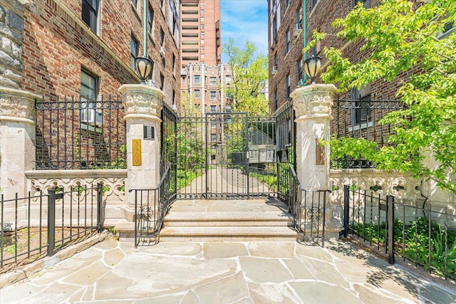gate featuring a fenced front yard