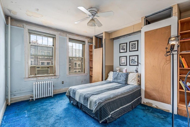 bedroom with radiator heating unit, carpet, cooling unit, and a ceiling fan