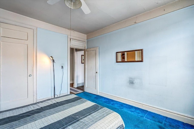unfurnished bedroom featuring ceiling fan and baseboards