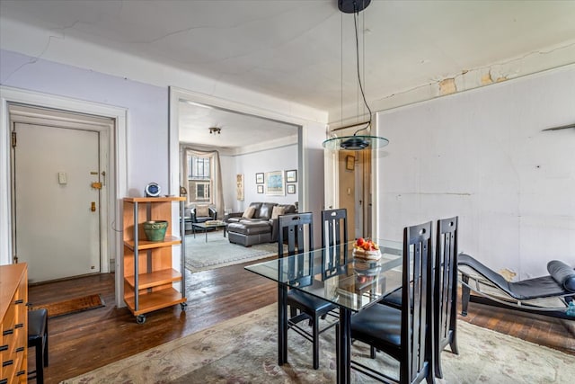 dining space with hardwood / wood-style flooring