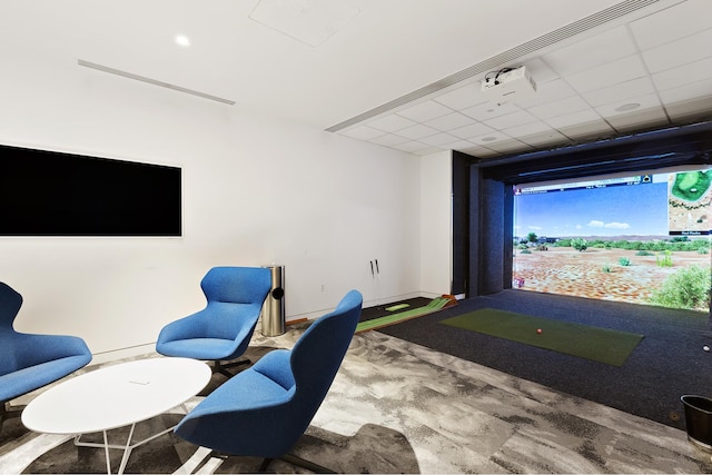 playroom featuring golf simulator and a drop ceiling