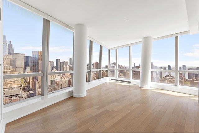 unfurnished sunroom featuring a view of skyline
