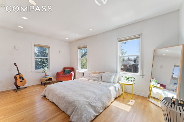 227 W 260th St, New York City, NY 10471 - bedroom featuring light wood finished floors, radiator heating unit, recessed lighting, and baseboards