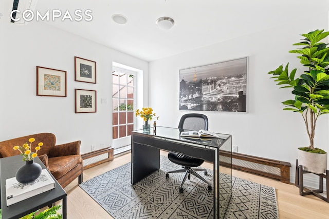 office area with light wood-style floors