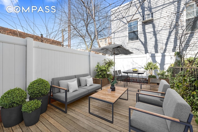 37 Powers St Unit 1A, New York City, NY 11211 - wooden deck featuring outdoor lounge area, a fenced backyard, and outdoor dining area