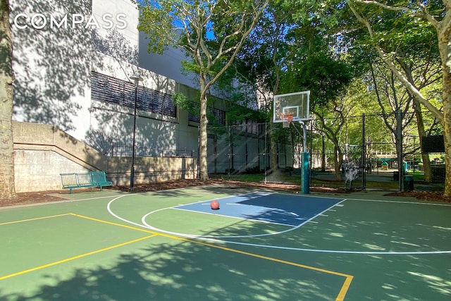 view of sport court featuring community basketball court and fence