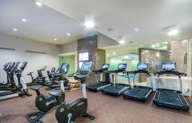 workout area featuring carpet flooring and recessed lighting