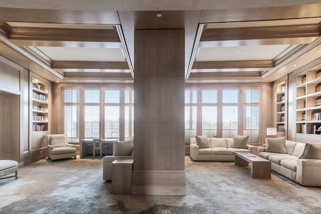 living area with built in shelves, carpet floors, plenty of natural light, crown molding, and coffered ceiling