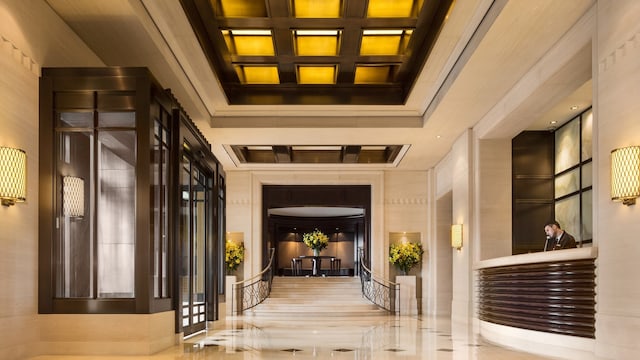 building lobby with coffered ceiling and beamed ceiling
