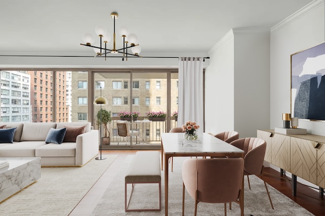 dining area featuring crown molding, a chandelier, and wood finished floors