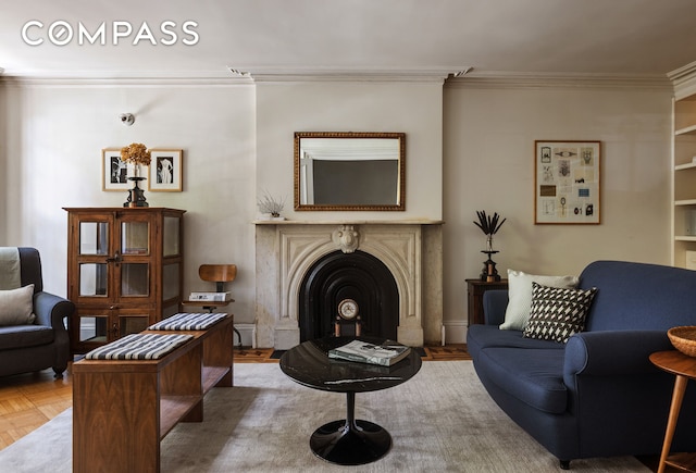 living room featuring ornamental molding, a fireplace, and wood finished floors
