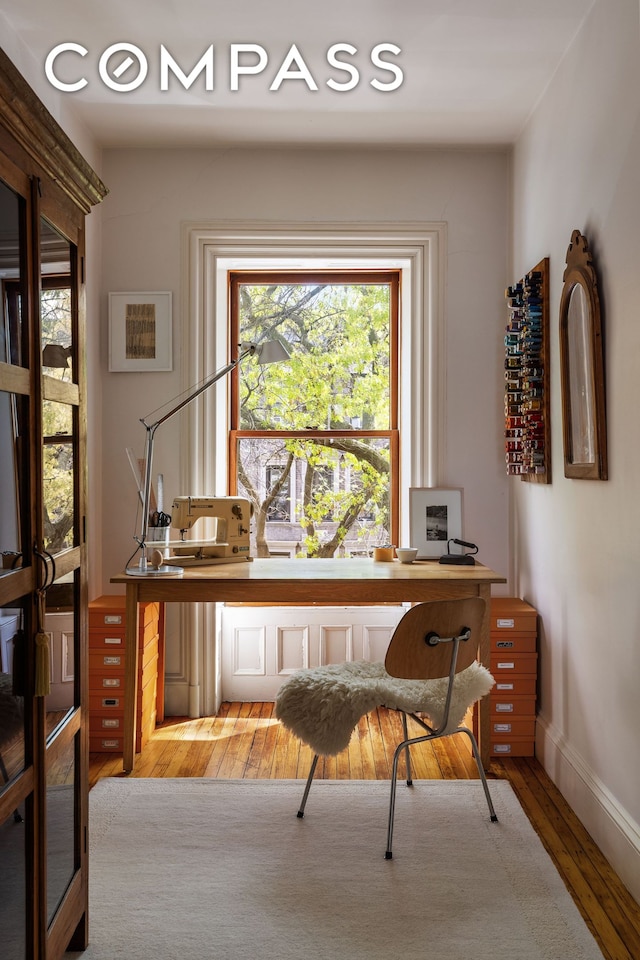 office with wood finished floors and baseboards
