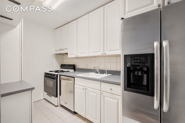 347 E 53rd St Unit 9C, New York City, NY 10022 - kitchen with stainless steel appliances, a sink, tasteful backsplash, white cabinetry, and under cabinet range hood