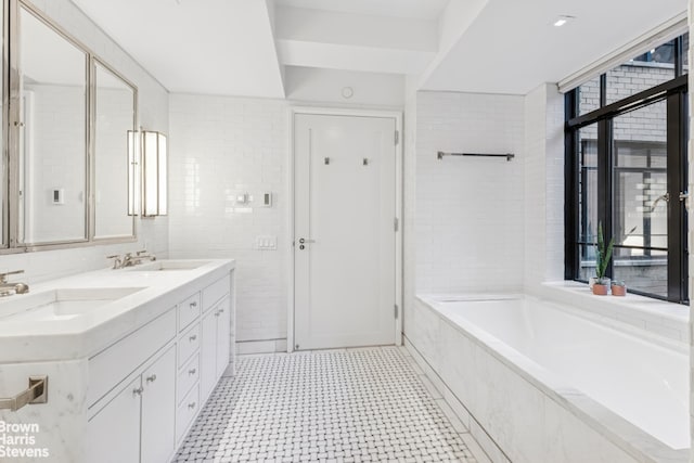 130 W 12th St Unit 1A, New York City, NY 10011 - bathroom with a bath, double vanity, and tile patterned floors