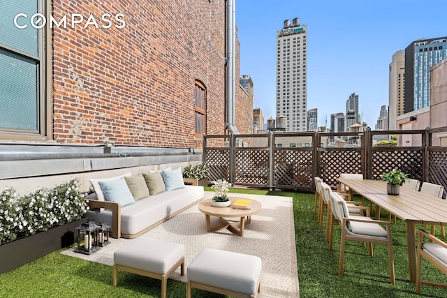146-148 W 22nd St Ph, Ph, New York City, NY 10011 - view of patio / terrace with outdoor lounge area and a view of skyline