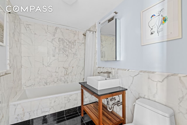 146-148 W 22nd St Ph, Ph, New York City, NY 10011 - bathroom featuring toilet, vanity, tiled shower / bath combo, and tile walls