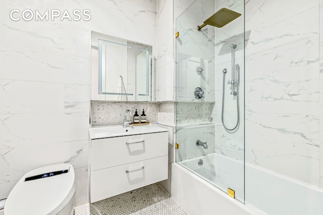 1404 Bushwick Ave Unit 1R, New York City, NY 11207 - bathroom with vanity, toilet, shower / tub combination, tile walls, and tile patterned flooring