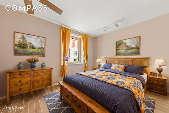 680 Washington St Unit 1B, New York City, NY 10014 - bedroom featuring track lighting, light wood-style flooring, and baseboards