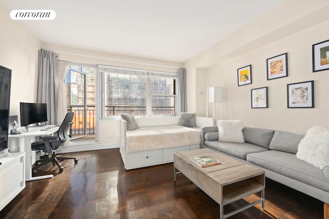 living room with healthy amount of natural light and an office area