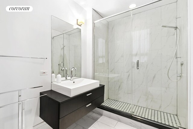 50 Pine St Unit Ph12N, New York City, NY 10005 - bathroom featuring vanity, a marble finish shower, and marble finish floors