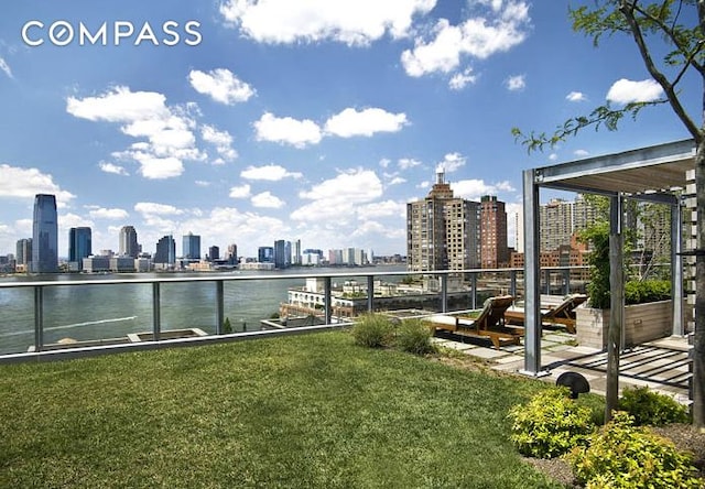 exterior space with a skyline view and a water view