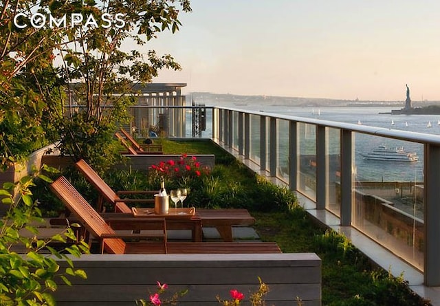balcony featuring a water view