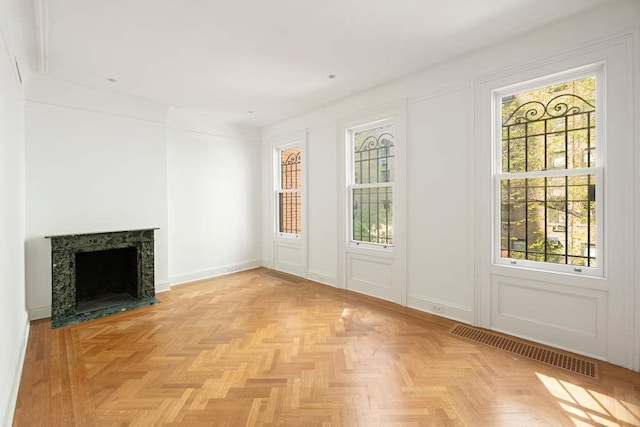 163 E 78th St, New York City, NY 10075 - unfurnished living room featuring healthy amount of natural light and a fireplace