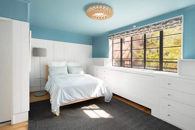 163 E 78th St, New York City, NY 10075 - bedroom featuring multiple windows and light wood-style floors