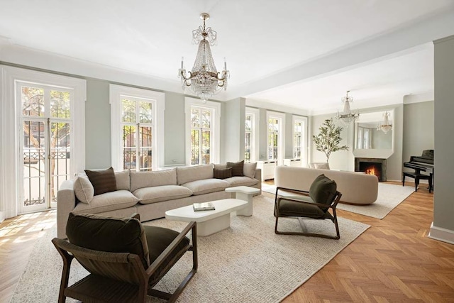 163 E 78th St, New York City, NY 10075 - living area with a chandelier, a warm lit fireplace, and baseboards