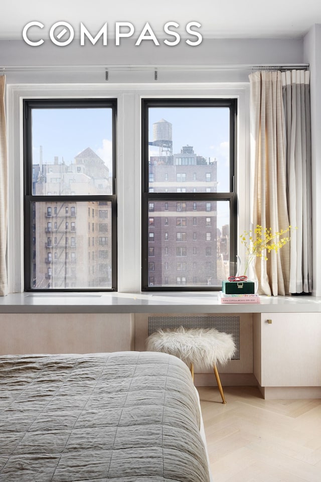bedroom featuring a city view