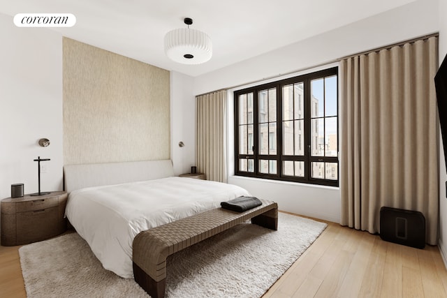 bedroom with light wood finished floors