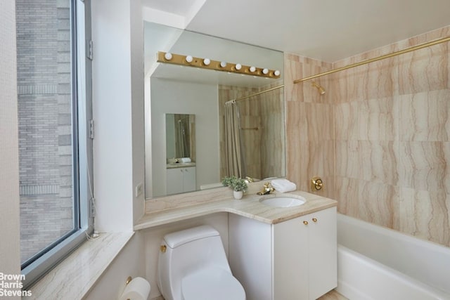 full bathroom featuring vanity, toilet, and shower / tub combo with curtain