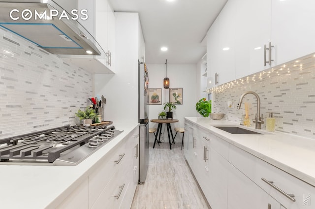 33-44 93rd St Unit 5X, New York City, NY 11372 - kitchen with a sink, premium range hood, stainless steel gas cooktop, and backsplash