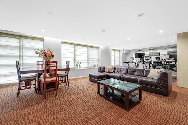 living area featuring carpet flooring and recessed lighting