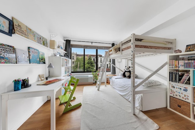 bedroom featuring wood finished floors
