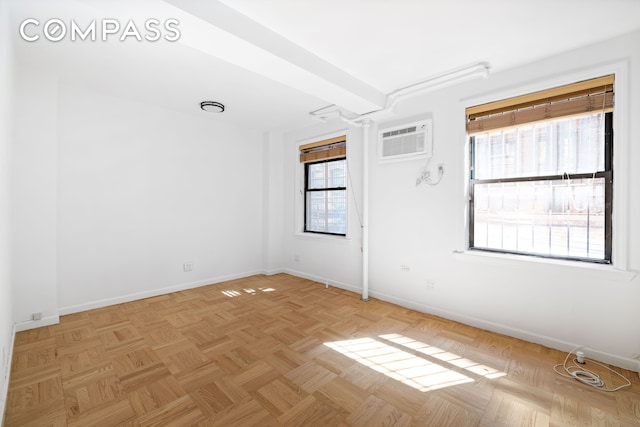 226-230 E 12th St Unit 1H, New York City, NY 10003 - unfurnished room with baseboards and a wall mounted air conditioner