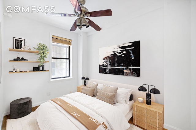 226-230 E 12th St Unit 1H, New York City, NY 10003 - bedroom with baseboards, wood finished floors, and ceiling fan