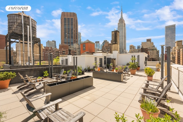 view of patio with a skyline view and outdoor lounge area