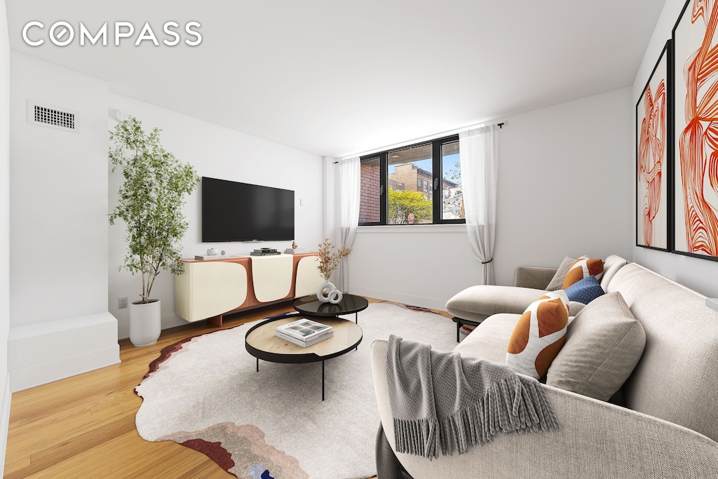 280 Nassau Ave Unit 1A, New York City, NY 11222 - living room with wood finished floors and baseboards