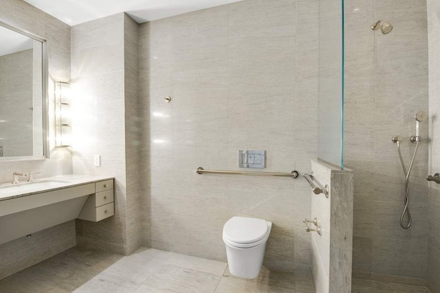475 Park Ave Unit 15A, New York City, NY 10022 - bathroom with tile walls, a walk in shower, toilet, and vanity