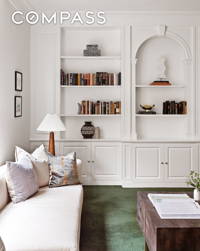 sitting room featuring built in features