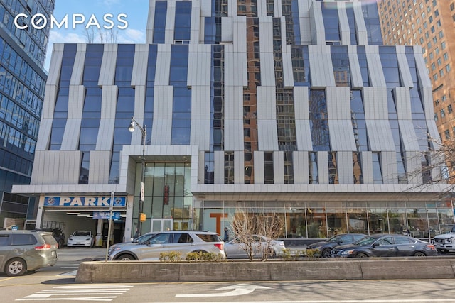 view of commercial property with uncovered parking