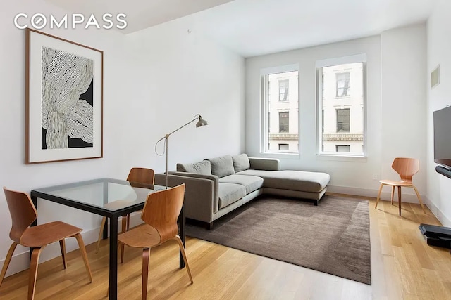 101 Leonard St Unit 4A, New York City, NY 10013 - living area with light wood-type flooring and baseboards