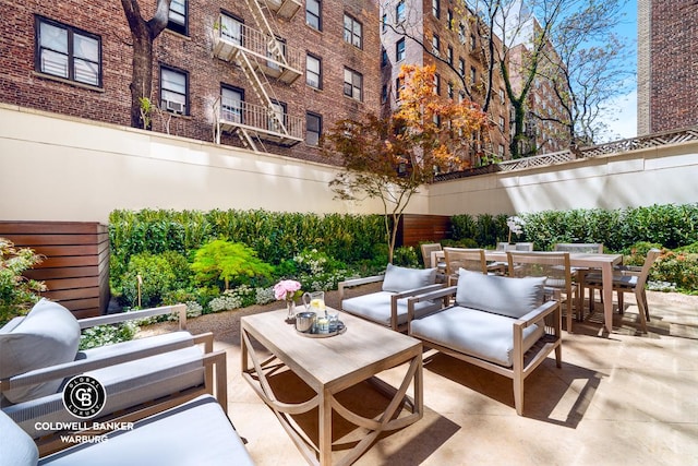 view of patio with outdoor dining space and an outdoor living space