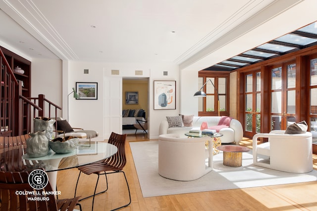 living room featuring wood finished floors and stairs