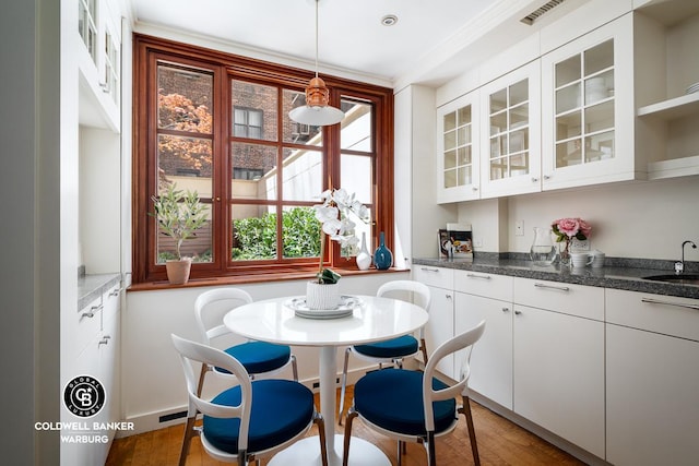 dining area with wood finished floors