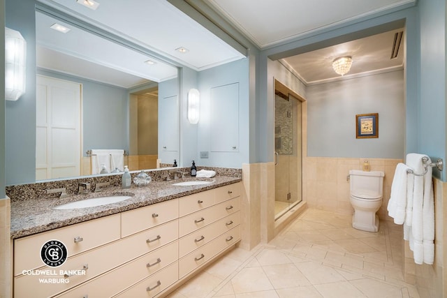 bathroom featuring crown molding, a shower stall, toilet, tile patterned flooring, and double vanity
